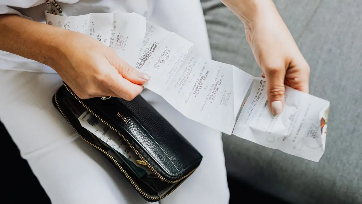 A Person Holding a Wallet